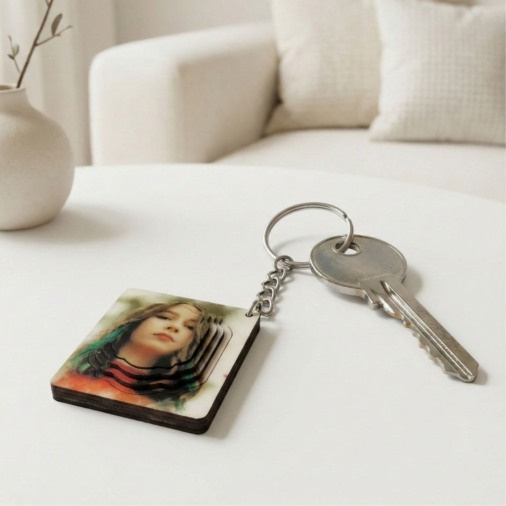 Keychain with a photo of a person on a white surface